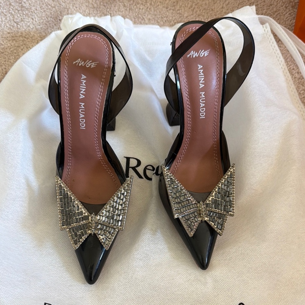 Amina Muaddi Black Patent Slingback Pumps with Crystal Bow